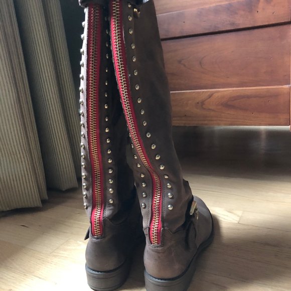 steve madden boots with red zipper up the back
